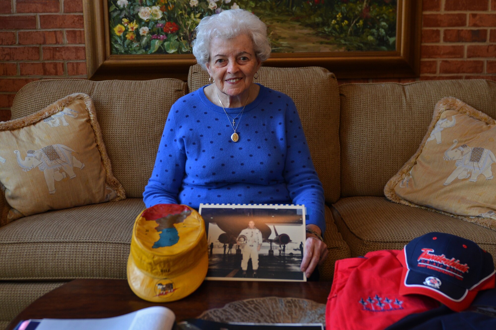 Barbara Ellis, wife of retired U.S. Air Force Maj. Gen. Billy Ellis, sits with some of her husband’s memorabilia in Sumter, S.C., Nov. 7, 2016. Throughout the duration of his career, Billy Ellis served as an Air Demonstration Squadron Thunderbirds pilot as well as an SR-71 Blackbird pilot. (U.S. Air Force photo by Airman 1st Class Christopher Maldonado)