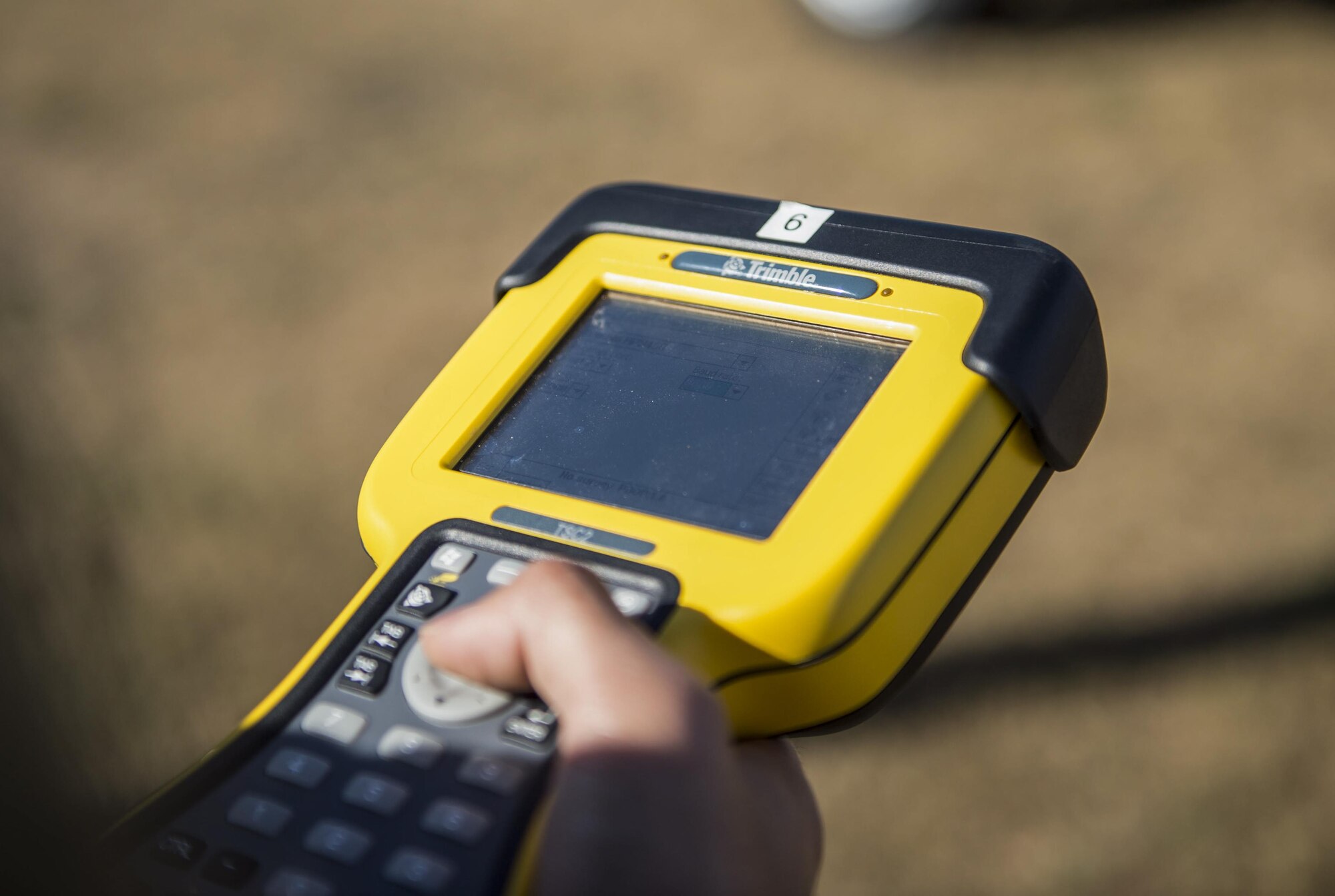 Senior Airman Giann Recapunra, an engineering specialist with the 1st Special Operations Civil Engineer Squadron, sets up a GPS to survey and verify the location and elevation of facilities on Hurlburt Field, Fla., Nov. 7, 2016. Engineering specialists’ duties include surveying, soil testing and computer-aided drafting. (U.S. Air Force photo by Airman 1st Class Isaac O. Guest IV)