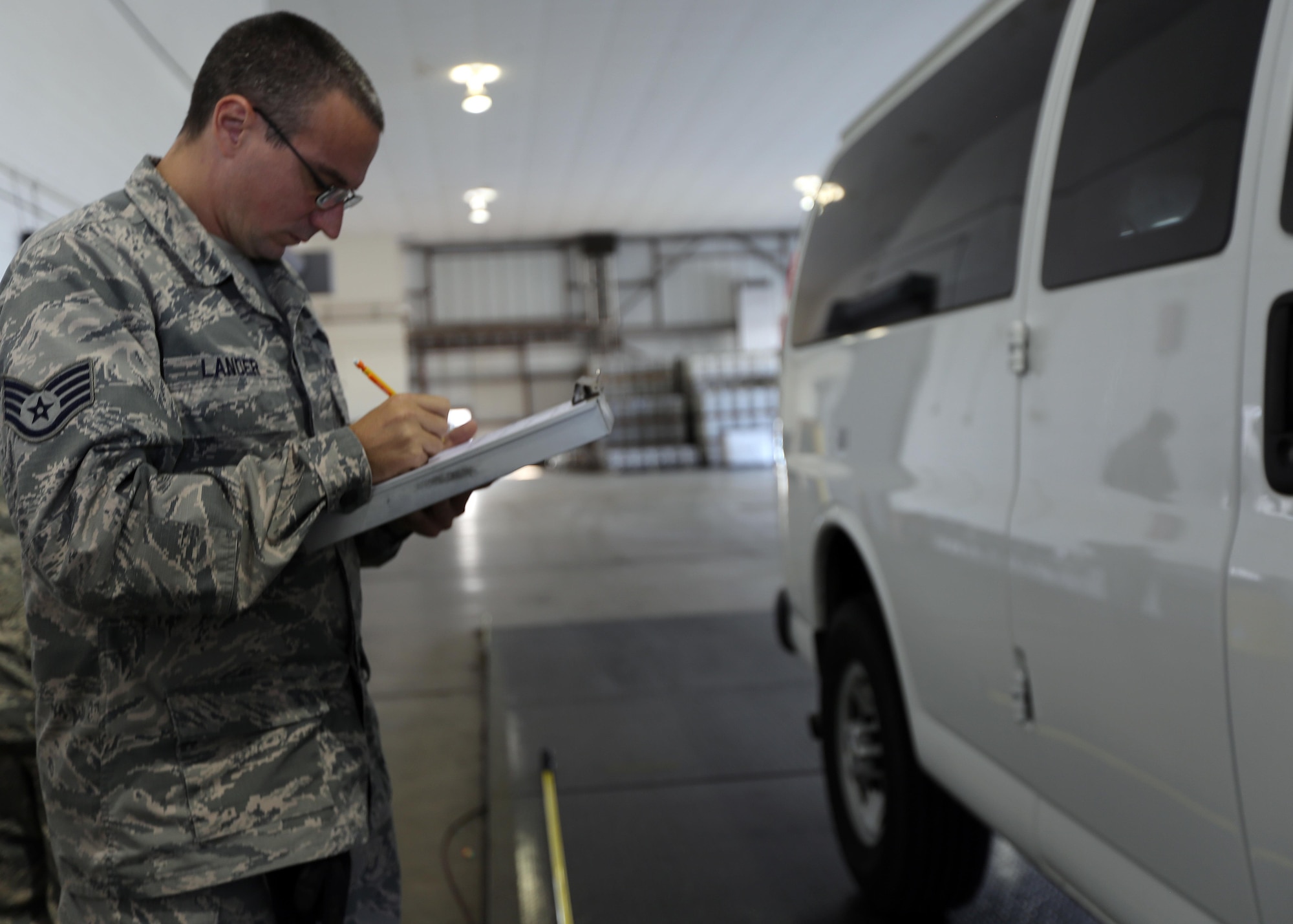 U.S. Air Force SSgt. Nicholas Lander, a small air terminal supervisor with the 735th Supply Chain Operations Group at Joint Base Langley-Eustis, Va., makes notes as he inspects a Joint Task Force Civil Support vehicle at Langley Air Force Base, Va., Nov. 2, 2016. Once it passes inspection the vehicle will then be loaded on to a Boeing C-17 Globemaster III for a deployment readiness exercise.  If practice makes perfect, then JTF-CS is ready to be called up with the right force, right response, and right expertise. (Official DOD photo by Ms. Tammy Cario)