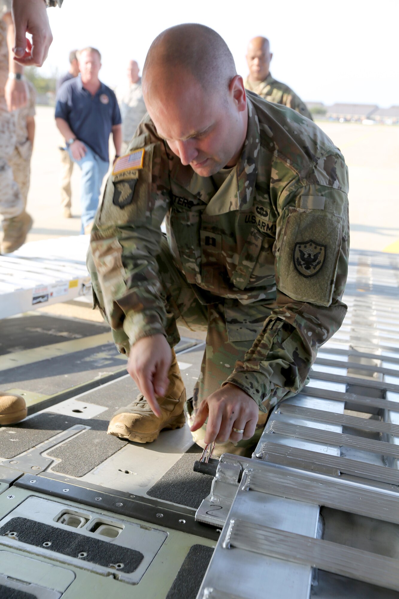 U.S. Army Capt. John Peters, a current operations action officer with Joint Task Force Civil Support, finishes assembling an approach shoring in preparation to load vehicles on to a Boeing C-17 Globemaster III at Joint Base Langley-Eustis, Va., Nov. 2, 2016. Loading the vehicles on to the C-17 is part of a deployment readiness exercise held by JTF-CS.  If practice makes perfect, then JTF-CS is ready to be called up with the right force, right response, and right expertise. (Official DOD photo by Ms. Tammy Cario)