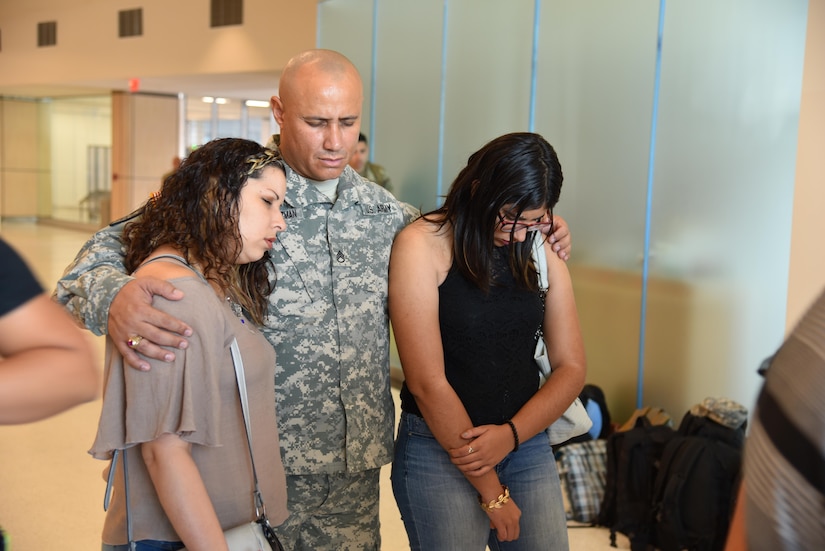 Approximately ten Army Reserve Soldiers from the 215th Military Police Company said good-bye to their family and loved ones at the Luis Munoz Marin Airport in San Juan, Puerto Rico on November 8. Brig. Gen. Alberto C. Rosende, 1st Mission Support Command commanding general, reassured them that the Soldiers were ready for their mission and reminded the unit how important it is to stay engaged with their families.