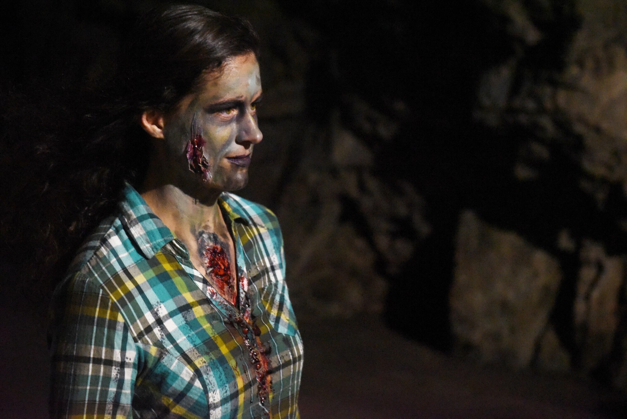 CHEYENNE MOUNTAIN AIR FORCE STATION, Colo. – A zombie waits for passersby to scare in the tunnel of Cheyenne Mountain during the Zombie 5K at Cheyenne Mountain Air Force Station, Colo., Nov. 4, 2016. Zombies hid in the shadows and attempted to scare 5k participants. (U.S. Air Force photo by David Meade)