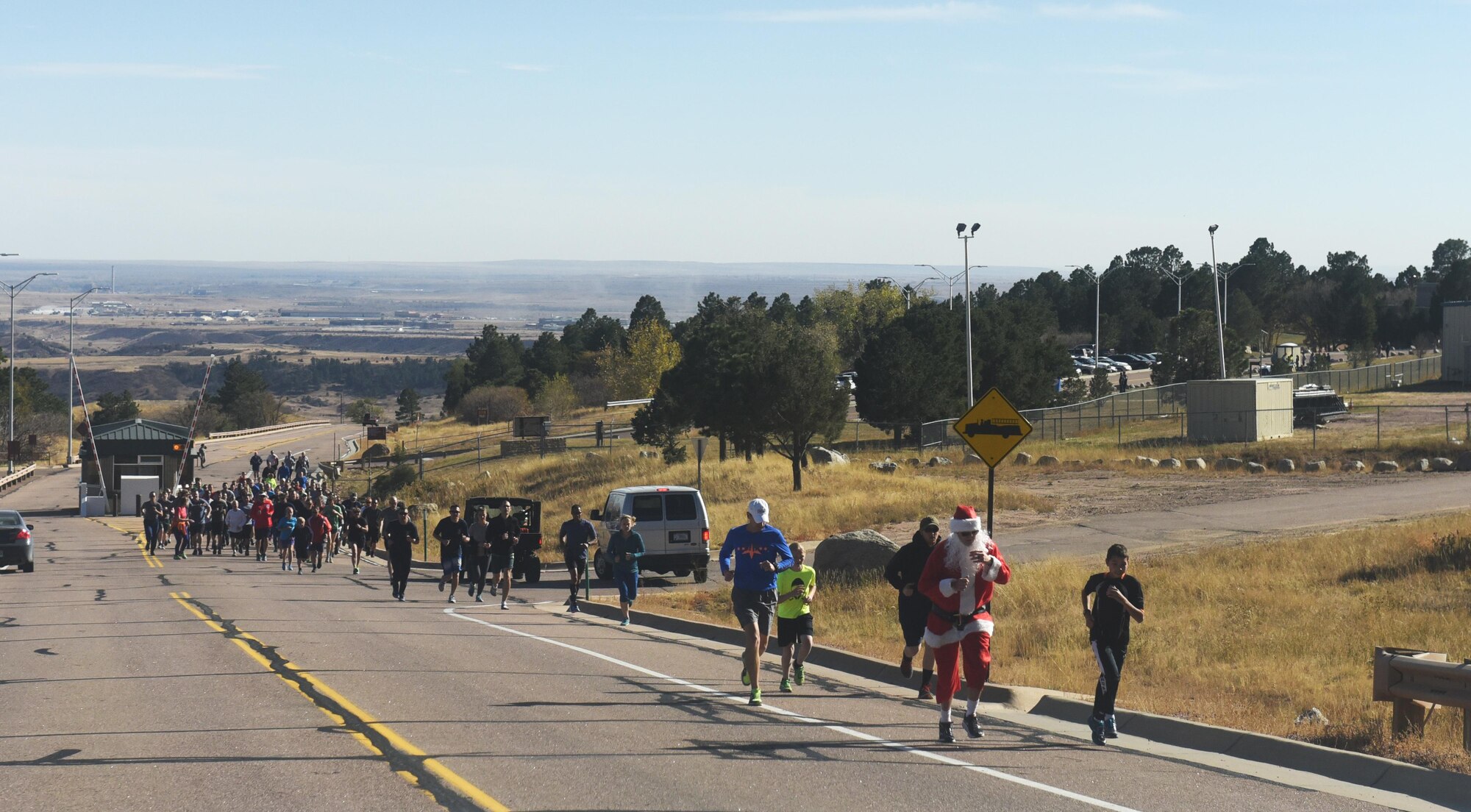 CHEYENNE MOUNTAIN AIR FORCE STATION, Colo. – Runners begin their ascent up the hill to reach the tunnel of Cheyenne Mountain during the Zombie 5K at Cheyenne Mountain Air Force Station, Colo., Nov. 4, 2016. Participants were met by zombies during their trek through the tunnel. (U.S. Air Force photo by David Meade)
