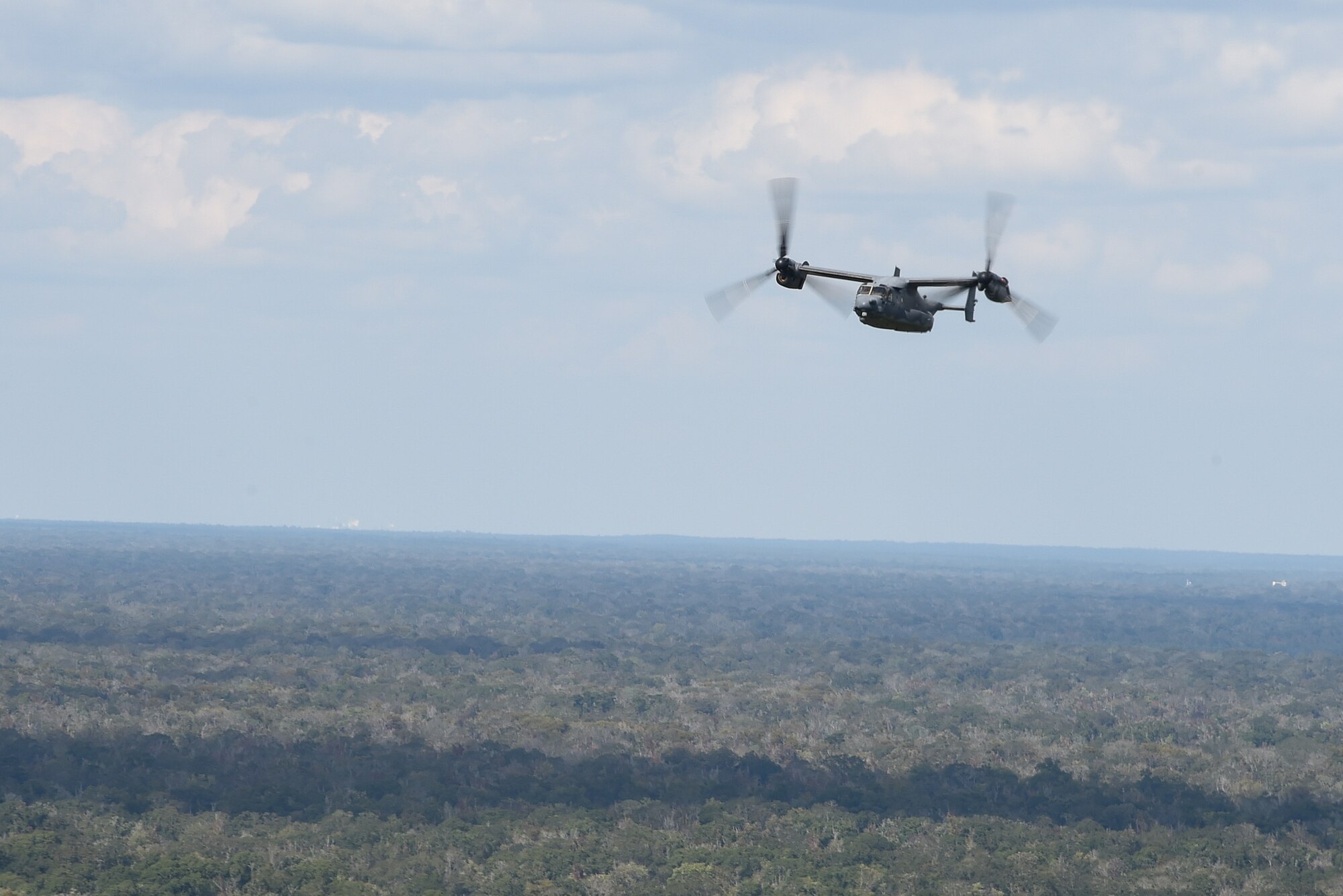 A CV-22 Osprey flies over Camp Shelby, Miss., during Task Force Exercise Southern Strike, Oct. 26, 2016. The CV-22 crews with the 8th Special Operations Squadron provided infiltration/exfiltration and fast-roping training for Naval Special Warfare personnel. (U.S. Air Force photo by Senior Airman Jeff Parkinson)