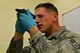 U.S. Air Force Senior Airman Coleman Kepner, 20th Logistics Readiness Squadron fuels lab technician, looks through a refractometer at Shaw Air Force Base, S.C., Nov. 9, 2016. The refractometer was used to inspect Jet A fuel for fuels system icing inhibitor, which prevents water in the fuel from freezing at high altitudes. (U.S. Air Force photo by Airman 1st Class Destinee Sweeney)