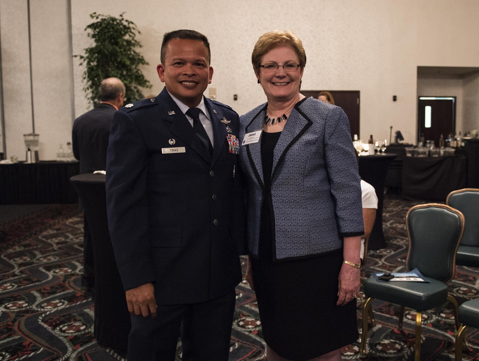Lt. Col. Eric Trias, commander of the Cyber Support Squadron poses for a picture with Dr. Janet Fontenot, dean of the Business Division of Southwestern Illinois College. (U.S. Air Force photo by Staff Sgt. Jodi Martinez)