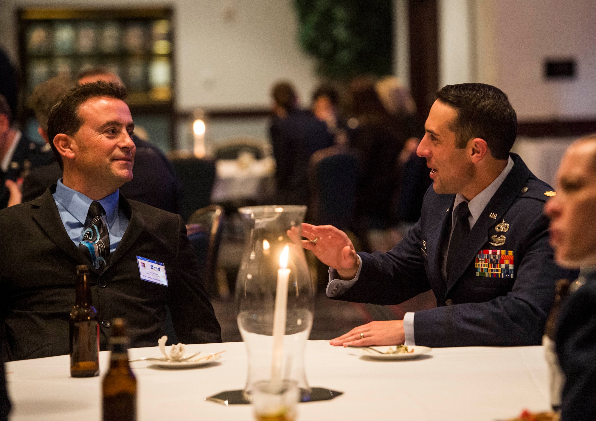 Brad Reinhardt, Giltner St. Louis president, speaks to Maj. Kazimir Kostrubala, 375th Logistics Readiness Squadron commander, Scott Air Force Base, Ill., Nov. 2, 2016. Reinhardt is an honorary commander of the 375th LRS. (U.S. Air Force photo by Staff Sgt. Jodi Martinez)