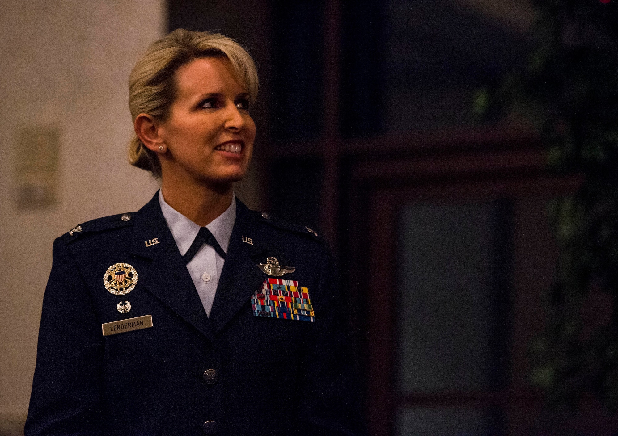 Col. Laura Lenderman, 375th Air Mobility Wing commander, smiles as she listens to a speech on the mission of Scott at the Scott Event Center, Scott Air Force Base, Ill., Nov. 2, 2016. (U.S. Air Force photo by Staff Sgt. Jodi Martinez)