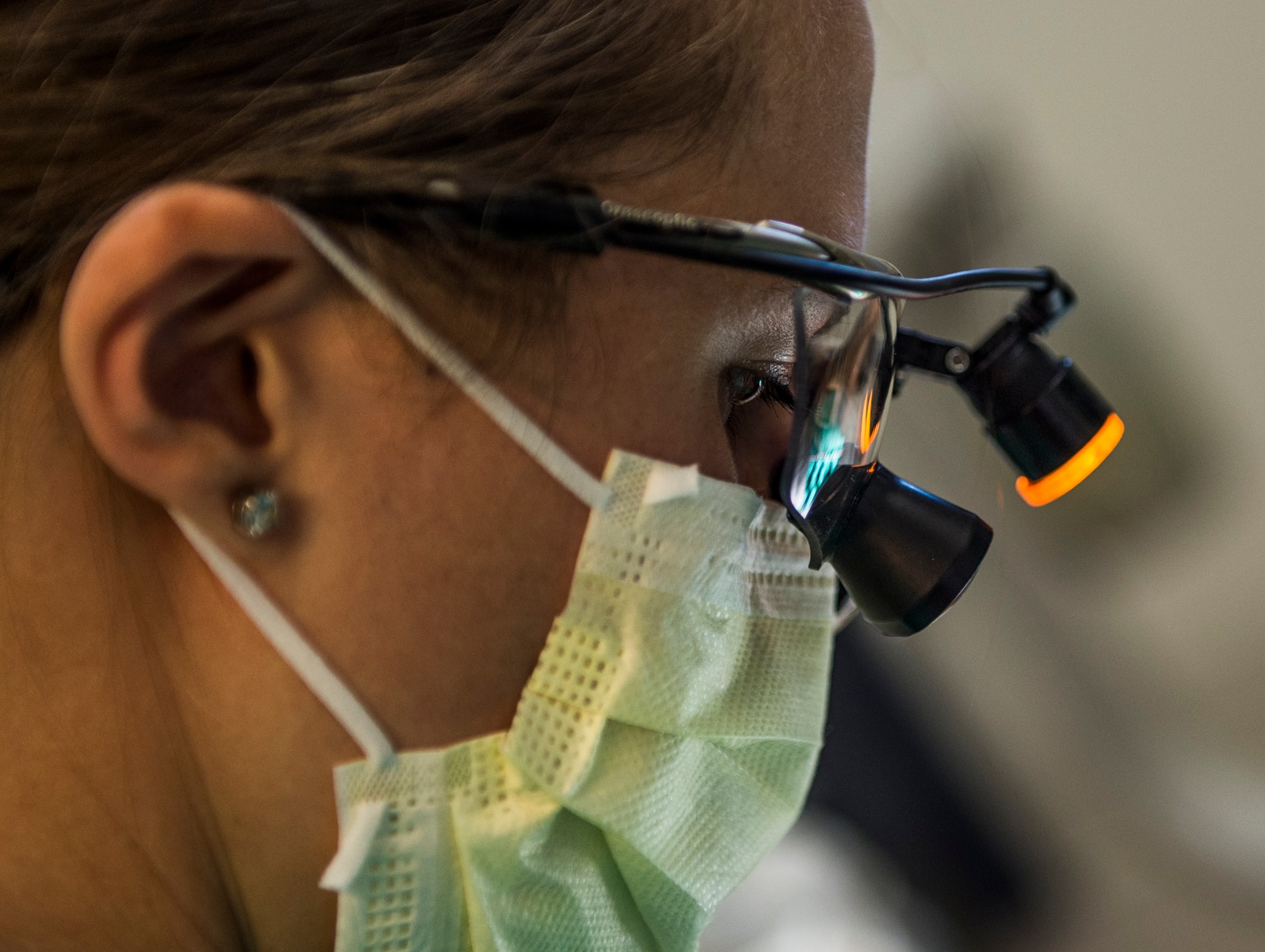 Capt. Rachael Sells conducts an operation to give a patient braces, Scott Air Force Base, Ill., Oct. 25, 2016. Sells is one of four residents in the Advanced Education in General Dentistry Program.