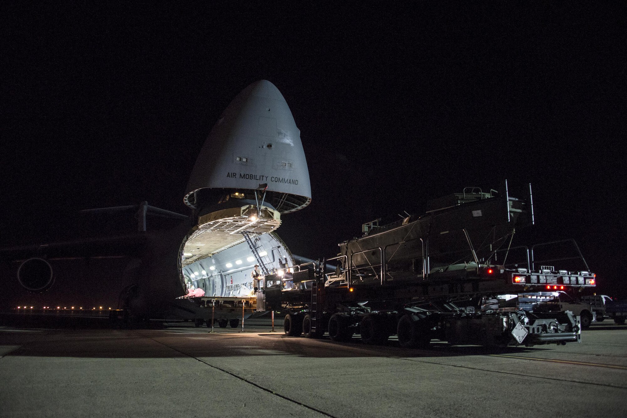 A U.S. Army Bridge Erection Boat (BEB) is uploaded onto a C-5M Super Galaxy May 7, 2016, at Travis Air Force Base, Calif. The 60th Aerial Port Squadron successfully uploaded multiple BEBs and bridges onto the aircraft in support of the counter-Islamic State of Iraq and the Levant campaign in Iraq as part of Operation Inherent Resolve. BEBs are used to deploy the bridges in wet-gap crossings. (U.S. Air Force photo by Staff Sgt. Charles Rivezzo)