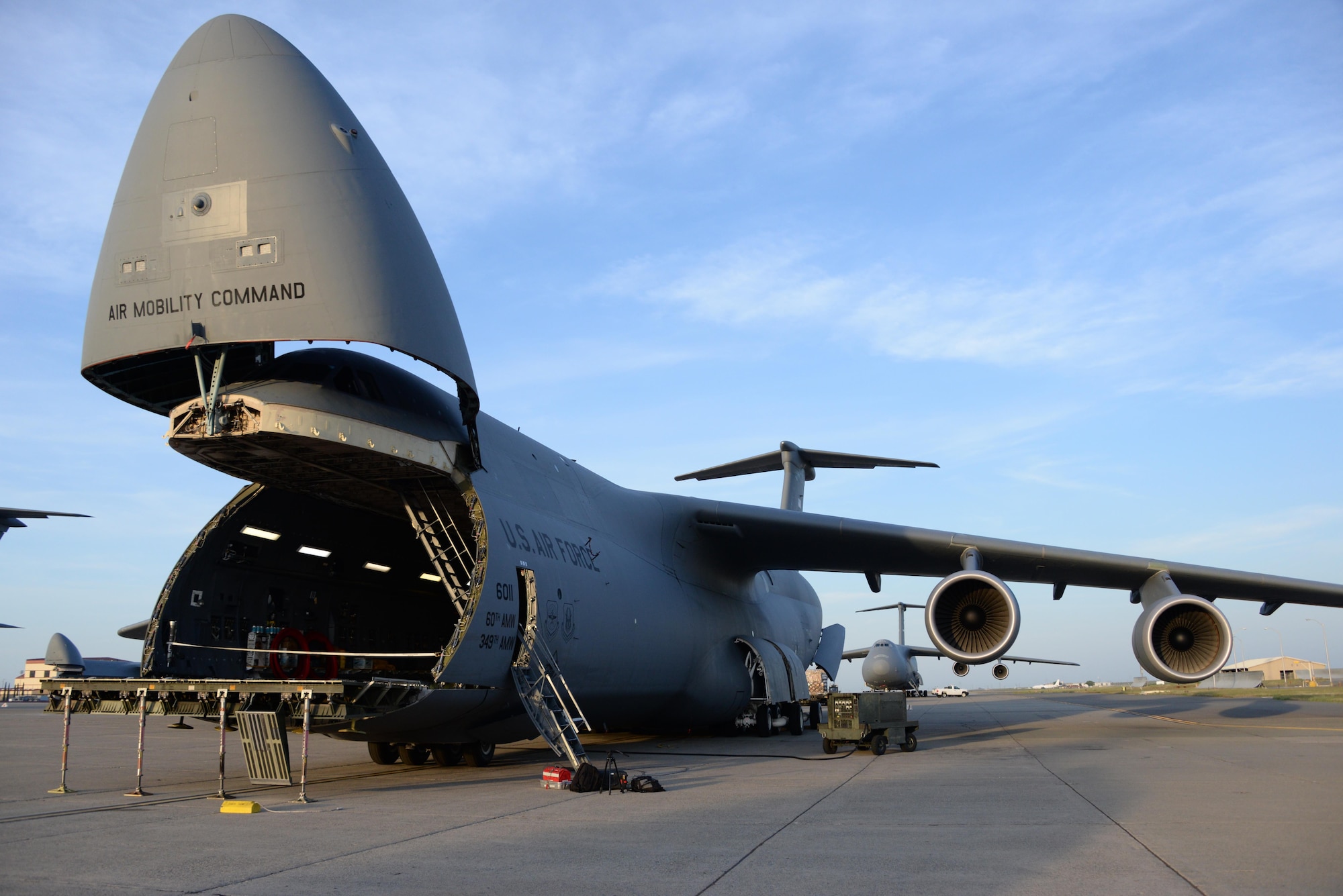 Airmen from the 60th Aerial Port Squadron load a C-5M Super Galaxy with essential cargo and U.S. Army Bridge Erection boats and bridges, May 12, 2016, at Travis Air Force Base, Calif. The bridges and cargo were flown to Iraq by the 22nd Airlift Squadron and directly contributed to the counter-Islamic State of Iraq and the Levant campaign during Operation Inherent Resolve in Mosul, Iraq. (U.S. Air Force photos by Senior Airman Amber Carter)