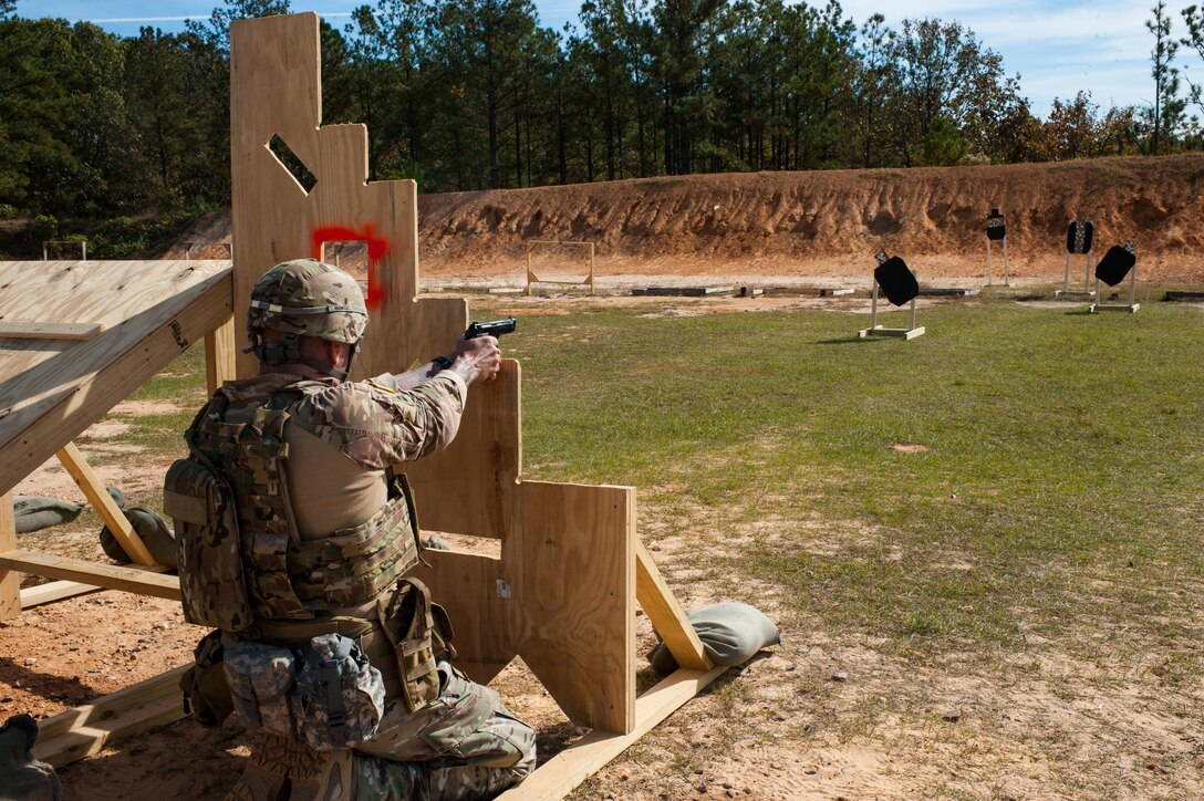 Master Sgt. Robert Mango, with the 9th Mission Support Command and the U.S. Army Reserve Combat Marksmanship Program, engages targets on the second day of the U.S. Army Forces Command Weapons Marksmanship Competition Nov. 8, 2016, at Fort Bragg, N.C. The four-day FORSCOM competition features marksmen from the U.S. Army, U.S. Army Reserve, and the National Guard in events for the M9 pistol, the M4A1 rifle and the M249 SAW, or Squad Automatic Weapon, to recognize Soldiers who are beyond expert marksmen. The multi-tiered events challenge the competitors' ability to accurately and quickly engage targets in a variety of conditions and environments. (U.S. Army photo by Timothy L. Hale/Released)