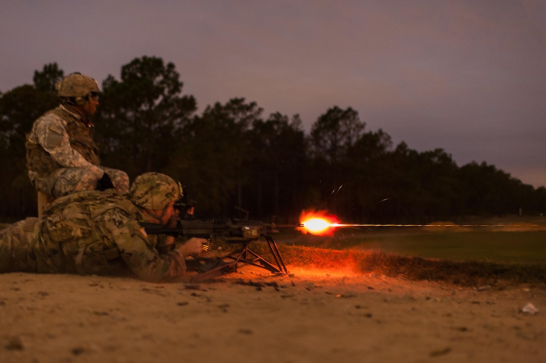 Sgt. 1st Class Joel Micholick, with the 9th Battalion, U.S. Army Careers Division, and the U.S. Army Reserve Combat Marksmanship Program, engages targets during a night fire event on the second day of the U.S. Army Forces Command Weapons Marksmanship Competition Nov. 8, 2016, at Fort Bragg, N.C. The four-day FORSCOM competition features marksmen from the U.S. Army, U.S. Army Reserve, and the National Guard in events for the M9 pistol, the M4A1 rifle and the M249 SAW, or Squad Automatic Weapon, to recognize Soldiers who are beyond expert marksmen. The multi-tiered events challenge the competitors' ability to accurately and quickly engage targets in a variety of conditions and environments. (U.S. Army photo by Timothy L. Hale/Released)
