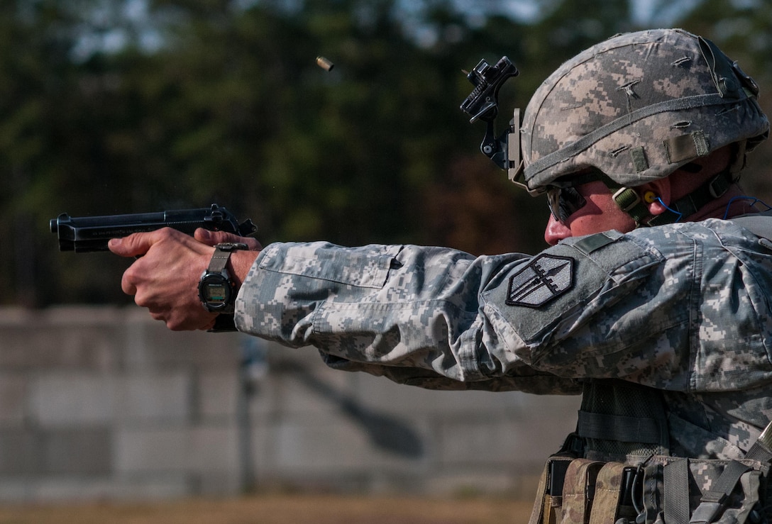 Staff Sgt. Thomas Walsh, with the 744th Engineer Company, 321st Engineer Battalion, engages targets in the novice category on the second day of the U.S. Army Forces Command Weapons Marksmanship Competition Nov. 8, 2016, at Fort Bragg, N.C. The four-day FORSCOM competition features marksmen from the U.S. Army, U.S. Army Reserve, and the National Guard in events for the M9 pistol, the M4A1 rifle and the M249 SAW, or Squad Automatic Weapon, to recognize Soldiers who are beyond expert marksmen. The multi-tiered events challenge the competitors' ability to accurately and quickly engage targets in a variety of conditions and environments. (U.S. Army photo by Timothy L. Hale/Released)