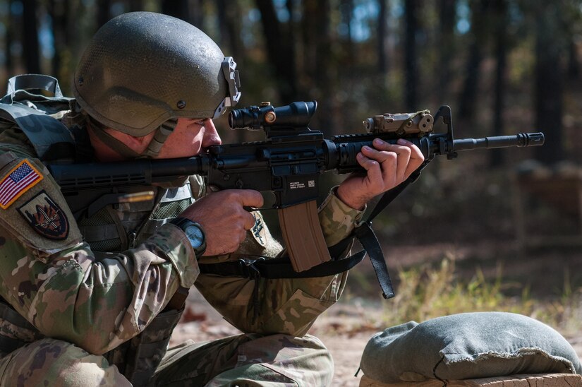 Sgt. Joseph Hall, with the 310th Psychological Operation Company and the U.S. Army Reserve Combat Marksmanship Program, engages targets on the second day of the U.S. Army Forces Command Weapons Marksmanship Competition Nov. 8, 2016, at Fort Bragg, N.C. The four-day FORSCOM competition features marksmen from the U.S. Army, U.S. Army Reserve, and the National Guard in events for the M9 pistol, the M4A1 rifle and the M249 SAW, or Squad Automatic Weapon, to recognize Soldiers who are beyond expert marksmen. The multi-tiered events challenge the competitors' ability to accurately and quickly engage targets in a variety of conditions and environments. (U.S. Army photo by Timothy L. Hale/Released)