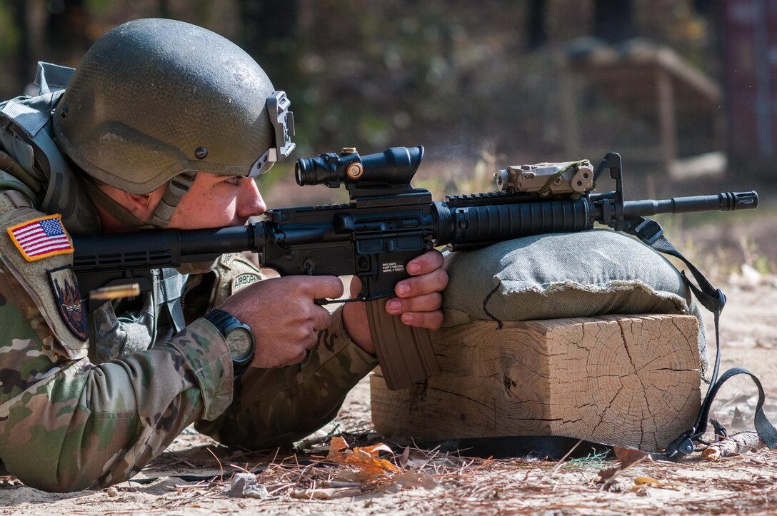 Sgt. Joseph Hall, with the 310th Psychological Operation Company and the U.S. Army Reserve Combat Marksmanship Program, engages targets on the second day of the U.S. Army Forces Command Weapons Marksmanship Competition Nov. 8, 2016, at Fort Bragg, N.C. The four-day FORSCOM competition features marksmen from the U.S. Army, U.S. Army Reserve, and the National Guard in events for the M9 pistol, the M4A1 rifle and the M249 SAW, or Squad Automatic Weapon, to recognize Soldiers who are beyond expert marksmen. The multi-tiered events challenge the competitors' ability to accurately and quickly engage targets in a variety of conditions and environments. (U.S. Army photo by Timothy L. Hale/Released)