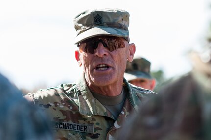 Command Sgt. Maj. Scott Schroeder, the U.S. Army Forces Command command sergeant major, talks with competitors on the second day of the U.S. Army Forces Command Weapons Marksmanship Competition Nov. 8, 2016, at Fort Bragg, N.C. The four-day FORSCOM competition features marksmen from the U.S. Army, U.S. Army Reserve, and the National Guard in events for the M9 pistol, the M4A1 rifle and the M249 SAW, or Squad Automatic Weapon, to recognize Soldiers who are beyond expert marksmen. The multi-tiered events challenge the competitors' ability to accurately and quickly engage targets in a variety of conditions and environments. (U.S. Army photo by Timothy L. Hale/Released)