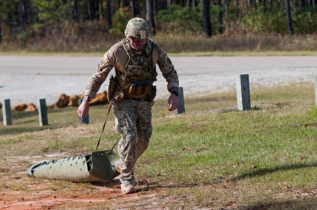 Master Sgt. Robert Mango, with the 9th Mission Support Command and the U.S. Army Reserve Combat Marksmanship Program, pulls a Skedo during the stress shoot event on the second day of the U.S. Army Forces Command Weapons Marksmanship Competition Nov. 8, 2016, at Fort Bragg, N.C. The four-day FORSCOM competition features marksmen from the U.S. Army, U.S. Army Reserve, and the National Guard in events for the M9 pistol, the M4A1 rifle and the M249 SAW, or Squad Automatic Weapon, to recognize Soldiers who are beyond expert marksmen. The multi-tiered events challenge the competitors' ability to accurately and quickly engage targets in a variety of conditions and environments. (U.S. Army photo by Timothy L. Hale/Released)