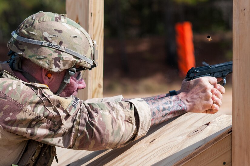 Master Sgt. Robert Mango, with the 9th Mission Support Command and the U.S. Army Reserve Combat Marksmanship Program, engages targets on the second day of the U.S. Army Forces Command Weapons Marksmanship Competition Nov. 8, 2016, at Fort Bragg, N.C. The four-day FORSCOM competition features marksmen from the U.S. Army, U.S. Army Reserve, and the National Guard in events for the M9 pistol, the M4A1 rifle and the M249 SAW, or Squad Automatic Weapon, to recognize Soldiers who are beyond expert marksmen. The multi-tiered events challenge the competitors' ability to accurately and quickly engage targets in a variety of conditions and environments. (U.S. Army photo by Timothy L. Hale/Released)