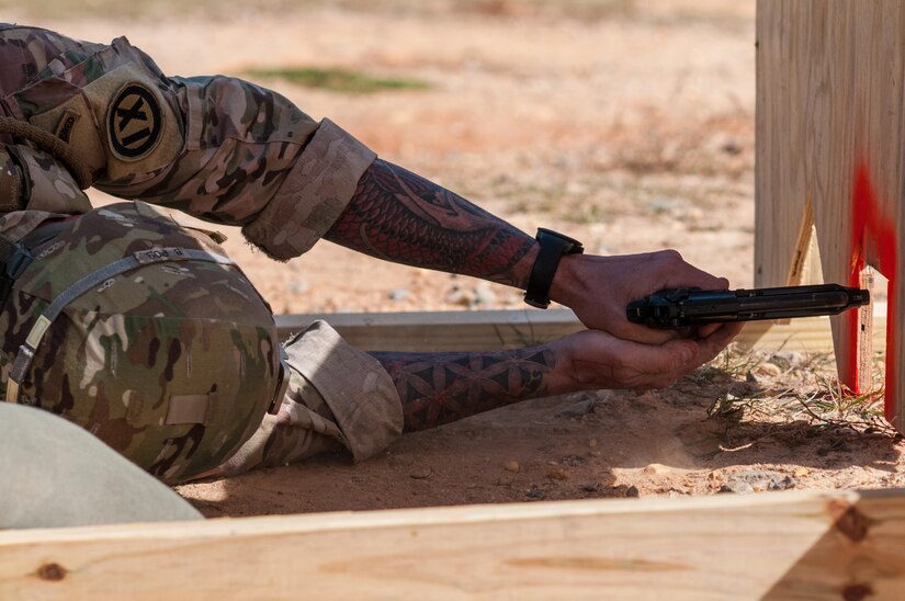 Master Sgt. Robert Mango, with the 9th Mission Support Command and the U.S. Army Reserve Combat Marksmanship Program, engages targets on the second day of the U.S. Army Forces Command Weapons Marksmanship Competition Nov. 8, 2016, at Fort Bragg, N.C. The four-day FORSCOM competition features marksmen from the U.S. Army, U.S. Army Reserve, and the National Guard in events for the M9 pistol, the M4A1 rifle and the M249 SAW, or Squad Automatic Weapon, to recognize Soldiers who are beyond expert marksmen. The multi-tiered events challenge the competitors' ability to accurately and quickly engage targets in a variety of conditions and environments. (U.S. Army photo by Timothy L. Hale/Released)