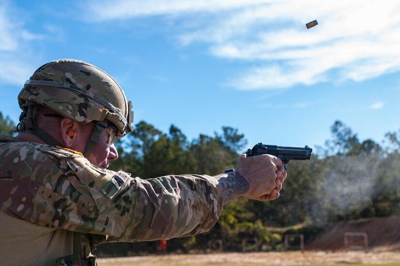 Master Sgt. Robert Mango, with the 9th Mission Support Command and the U.S. Army Reserve Combat Marksmanship Program, engages targets on the second day of the U.S. Army Forces Command Weapons Marksmanship Competition Nov. 8, 2016, at Fort Bragg, N.C. The four-day FORSCOM competition features marksmen from the U.S. Army, U.S. Army Reserve, and the National Guard in events for the M9 pistol, the M4A1 rifle and the M249 SAW, or Squad Automatic Weapon, to recognize Soldiers who are beyond expert marksmen. The multi-tiered events challenge the competitors' ability to accurately and quickly engage targets in a variety of conditions and environments. (U.S. Army photo by Timothy L. Hale/Released)