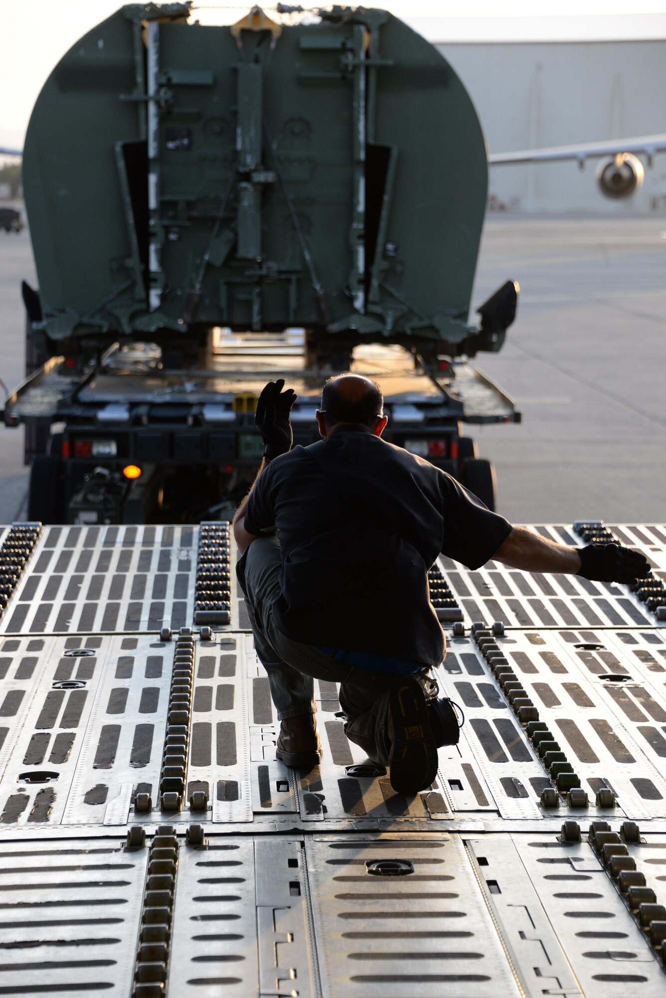 Airmen from the 60th Aerial Port Squadron load a C-5M Super Galaxy with essential cargo and U.S. Army Bridge Erection boats and bridges, May 12, 2016, at Travis Air Force Base, Calif. The bridges and cargo were flown to Iraq by the 22nd Airlift Squadron and directly contributed to the counter-Islamic State of Iraq and the Levant campaign during Operation Inherent Resolve in Mosul, Iraq. (U.S. Air Force photos by Senior Airman Amber Carter)