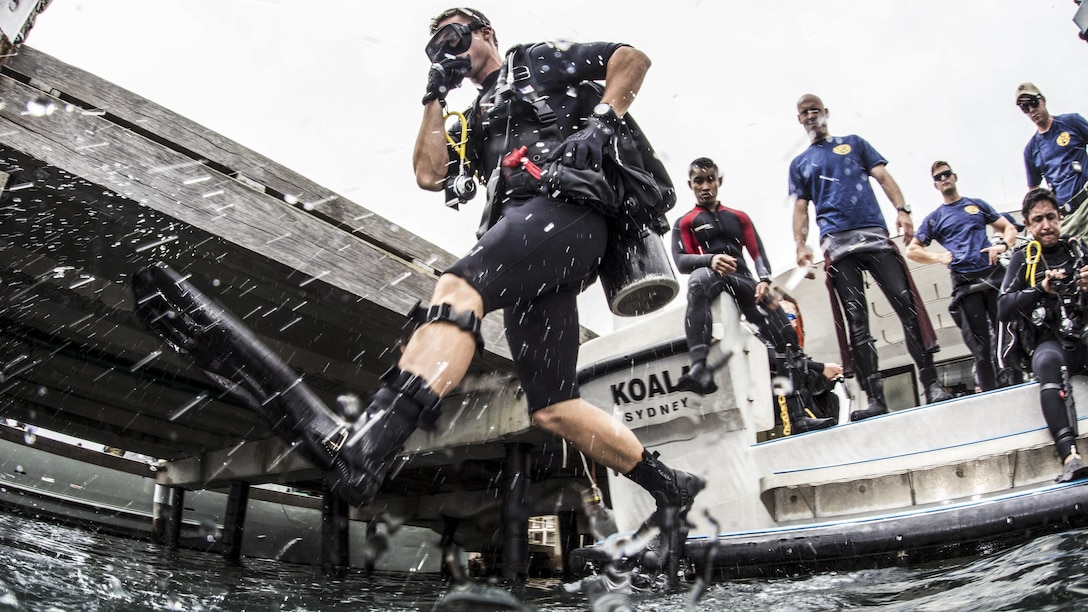 Navy Petty Officer 2nd Class Don Harper enters the water for scuba operations during Exercise Dugong 2016 in Sydney, Nov. 8, 2016. Navy photo by Petty Officer 1st Class Arthurgwain L. Marquez