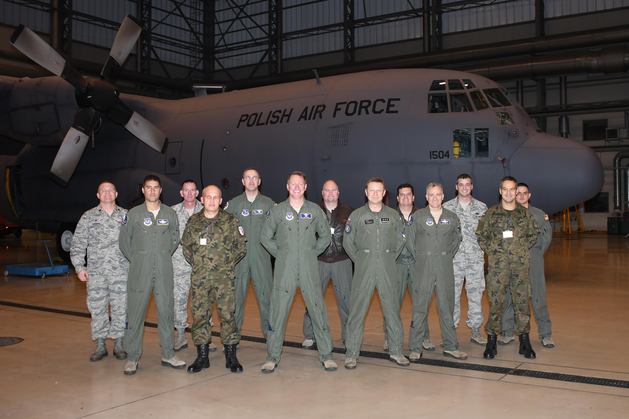 Brig. Gen. Patrick Wade, Mobilization Assistant to the Commander, U.S. Air Forces in Europe and Air Forces Africa, stands with members of the U.S. Air Force and Polish air force, while visiting Powidz Air Base, Poland, Oct. 19, 2016. Wade visited the base to meet with Powidz AB leadership, members of the 94th Airlift Wing, from Dobbins Air Reserve Base, Ga., and members of the 86th Airlift Wing, from Ramstein Air Base, Germany, while the units trained jointly during Aviation Detachment 17-1 in support of Operation Atlantic Resolve. (U.S. Air Force photo by Staff Sgt. Alan Abernethy)