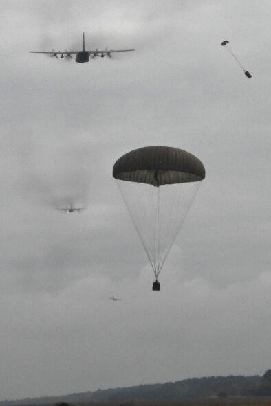 Airdropped cargo falls from a U.S. C-130H Hercules during a five-ship formation flight including U.S. and Polish air force aircraft, Oct. 26, 2016. The flight was a capstone event for Aviation Detachment 17-1, supporting Operation Atlantic Resolve, held at Powidz Air Base, Poland, Oct. 3-28. (U.S. Air Force photo by Staff Sgt. Alan Abernethy)