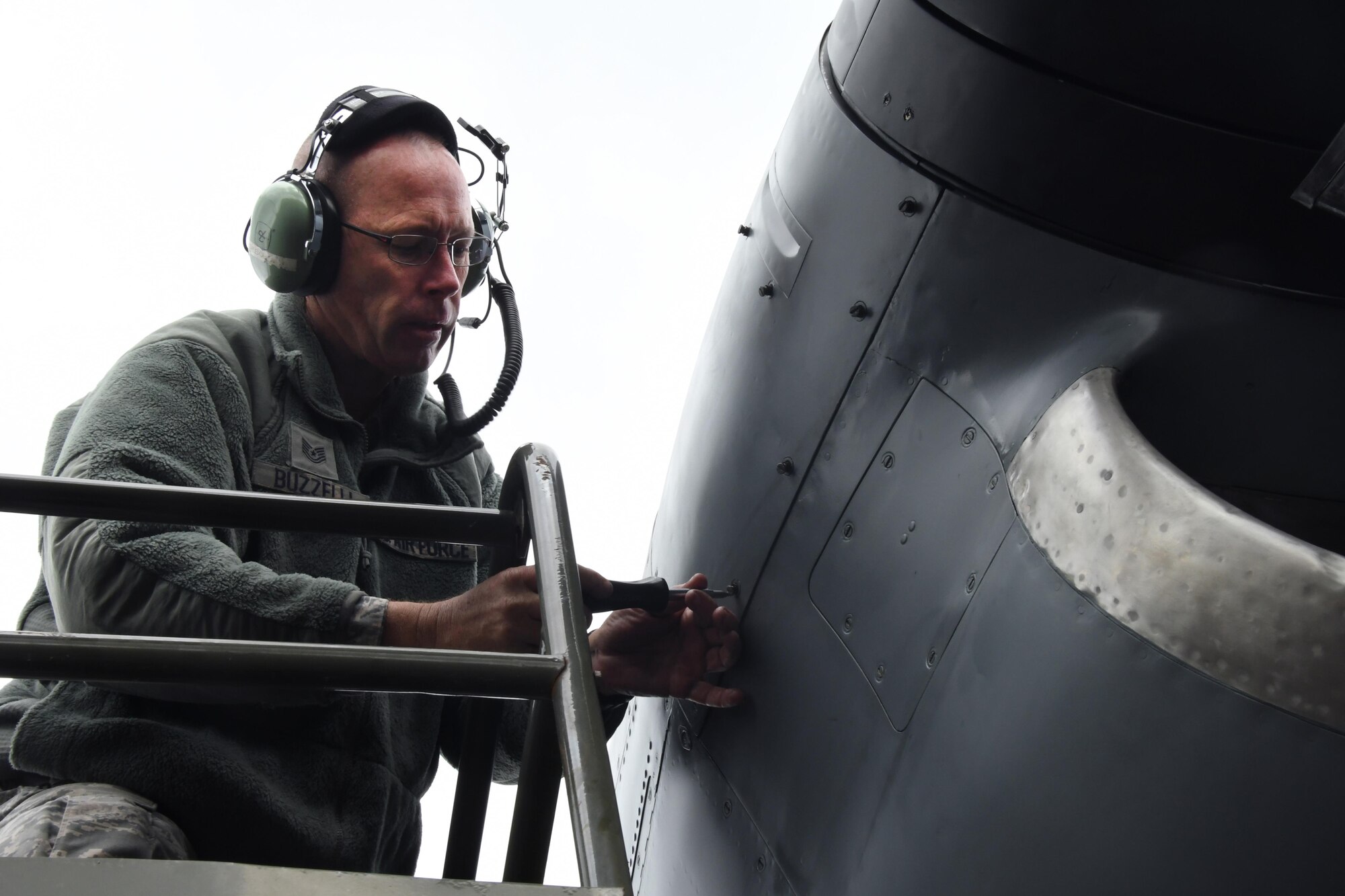 Tech. Sgt. Robert Buzzelli, 94th Maintenance Squadron, performs engine maintenance on a C-130H Hercules, while stopped en route to Powidz Air Base, Poland on Oct. 2, 2016. Members of the 94th Airlift Wing, Dobbins Air Reserve Base, Ga., and the 86th Airlift Wing, Ramstein Air Base, Germany, trained with the Polish air force during Aviation Detachment 17-1 in support of Operation Atlantic Resolve, Oct. 3-28. (U.S. Air Force photo by Staff Sgt. Alan Abernethy) 