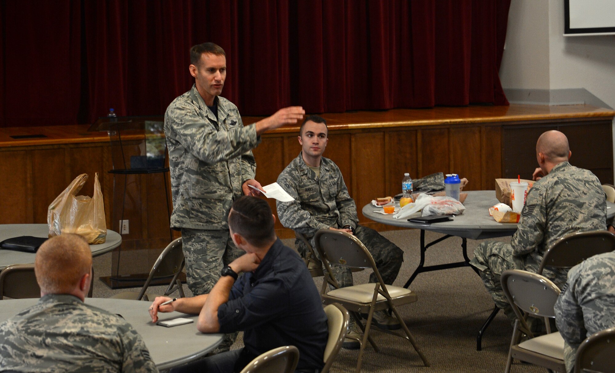 Col. Stephen Snelson, 62nd Airlift Wing vice commander, speaks to Airmen attending a Lunch and Leadership Lecture Nov. 4, 2016, at Joint Base Lewis-McChord, Wash. The first of an ongoing series, the training was held to provide relevant informal leadership advice to Airmen of all ranks. (U.S. Air Force photo/Senior Airman Jacob Jimenez) 