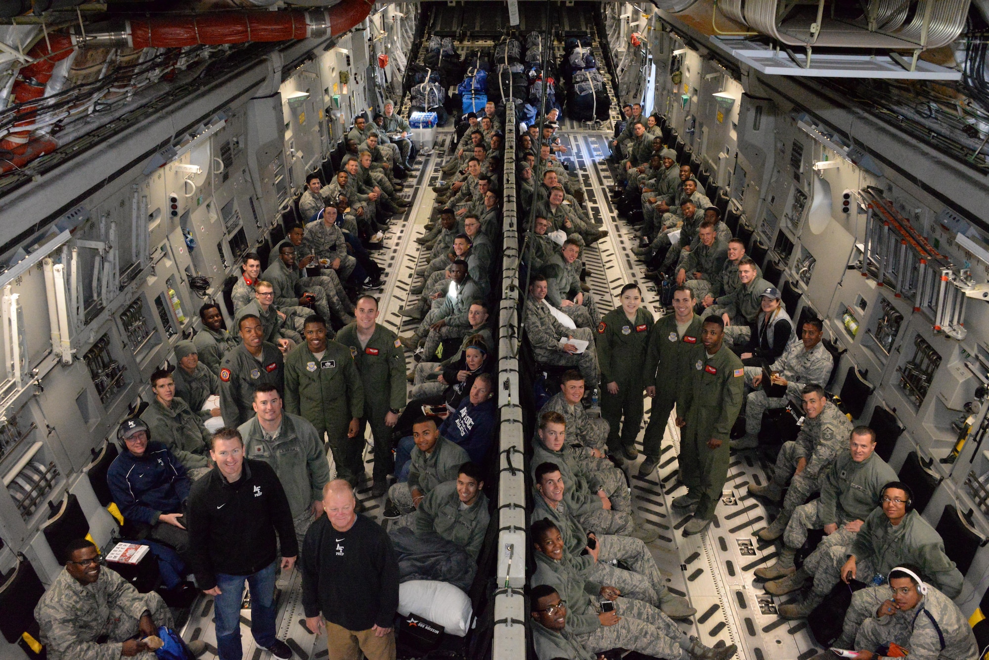 A C-17 Globemaster III crew from the 21st Airlift Squadron, Travis Air Force Base, Calif. poses for a photo with cadet candidates and staff members from the Air Force Academy Preparatory school.  The crew flew the cadet candidates from Colorado Springs, Colo. to Stewart International Airport, N.Y., to attend the Army West Point vs. Air Force football game Nov. 5.