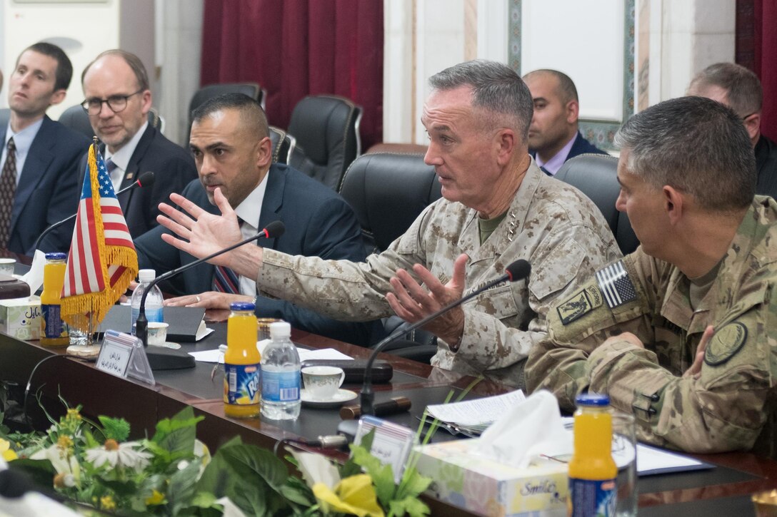 Marine Corps Gen. Joe Dunford, chairman of the Joint Chiefs of Staff, makes a point during a meeting with Iraqi Chief of Staff Army Gen. Othman al-Ghanami at Iraq’s Defense Ministry in Baghdad, Nov. 9, 2016. DoD Photo by D. Myles Cullen