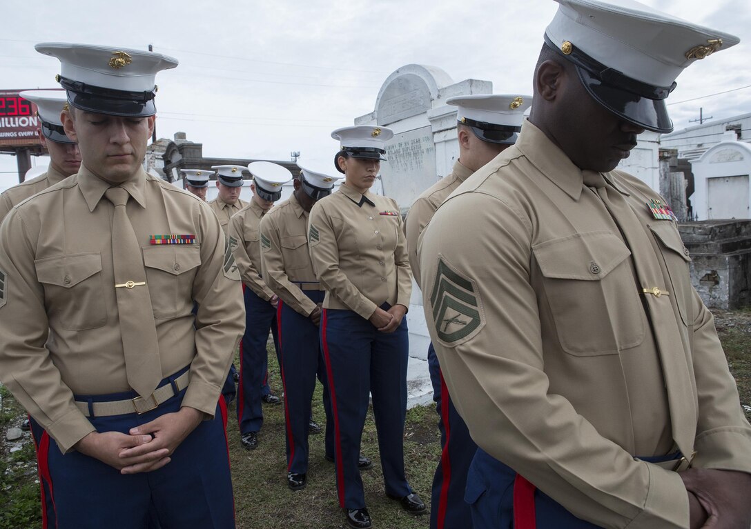Marines from Marine Forces Reserve bow their heads during the invocation at a wreath-laying ceremony for Major Daniel Carmick at St. Louis Cemetery No. 2 here, Nov. 9, 2016. The Marine Corps visits Carmick’s gravesite annually to conduct a wreath laying ceremony and commemorate his heroic actions.  Carmick led Marines during the Battle of New Orleans in the War of 1812, helping to repel the British forces attempting to take the city. (U.S. Marine Corps photo by Sgt. Sara Graham/released) 