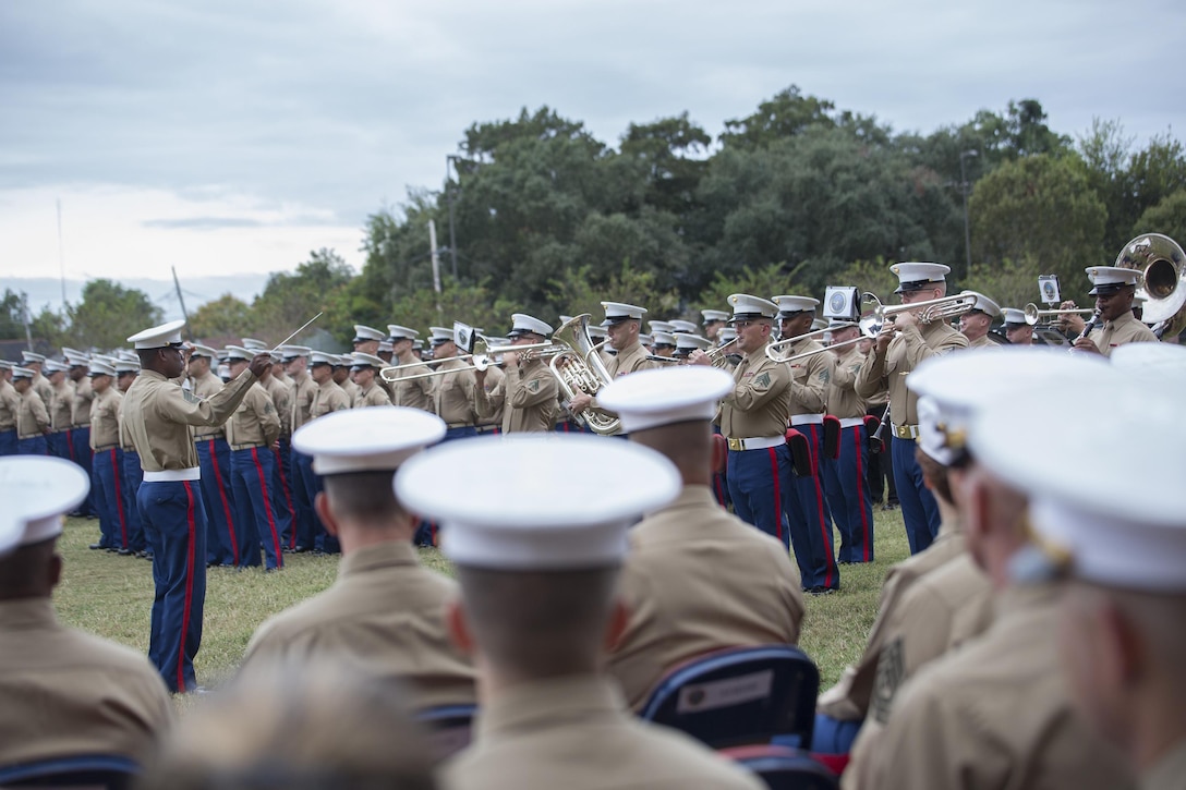 Marines from Marine Forces Reserve listen to Marine Corps Band New Orleans during the 241st Marine Corps birthday celebration here, Nov. 9, 2016. Each year, Marines celebrate the Corps’ birthday with a cake-cutting ceremony followed by a run. Since Nov. 10, 1775, the United States Marine Corps has earned the reputation as the world's most effective expeditionary fighting force – engaging in combat on battlefields across the globe. (U.S. Marine Corps photo by Sgt. Sara Graham)