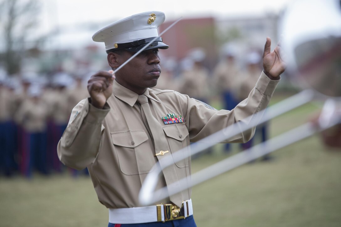 Gunnery Sgt. Justin A. Hauser, enlisted conductor of Marine Corps Band New Orleans, conducts a musical performance during the 241st Marine Corps birthday celebration here, Nov. 9, 2016. Each year, Marines celebrate the Corps’ birthday with a cake-cutting ceremony followed by a run. Since Nov. 10, 1775, the United States Marine Corps has earned the reputation as the world's most effective expeditionary fighting force – engaging in combat on battlefields across the globe. (U.S. Marine Corps photo by Sgt. Sara Graham)