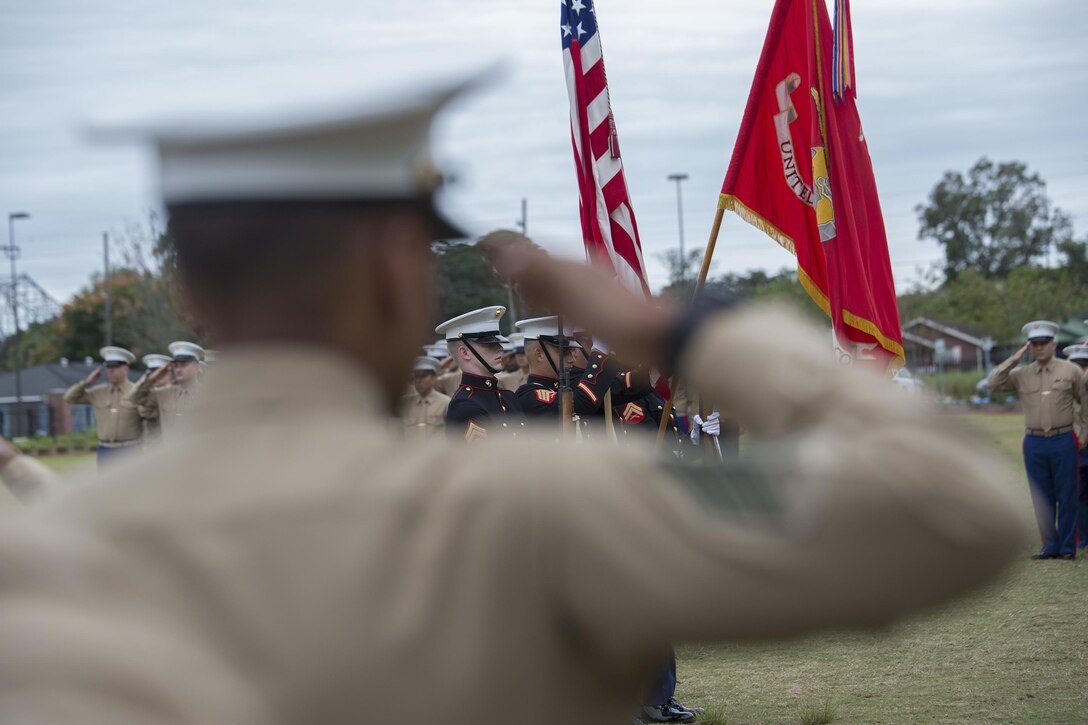 Marines from Marine Forces Reserve salute the colors during the 241st Marine Corps birthday celebration here, Nov. 9, 2016. Each year, the Marines celebrate the Corps’ birthday with a cake-cutting ceremony followed by a run. Since Nov. 10, 1775, the United States Marine Corps has earned the reputation as the world's most effective expeditionary fighting force – engaging in combat on battlefields across the globe. (U.S. Marine Corps photo by Sgt. Sara Graham)