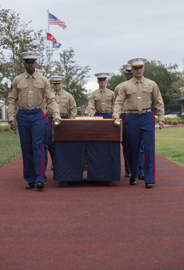 Marines from Marine Forces Reserve carry out the cake during the 241st Marine Corps birthday celebration here, Nov. 9, 2016. Each year, the Marines celebrate the Corps’ birthday with a cake-cutting ceremony followed by a run. Since Nov. 10, 1775, the United States Marine Corps has earned the reputation as the world's most effective expeditionary fighting force – engaging in combat on battlefields across the globe. (U.S. Marine Corps photo by Sgt. Sara Graham)