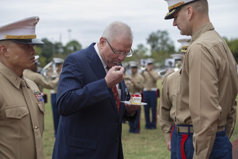 Mike Flynn, a Marine Corps veteran and guest of honor, takes a bite of cake as part of the cake-cutting ceremony for the 241st Marine Corps birthday celebration here, Nov. 9, 2016. Each year, the Marines celebrate the Corps’ birthday with a cake-cutting ceremony followed by a run. Since Nov. 10, 1775, the United States Marine Corps has earned the reputation as the world's most effective expeditionary fighting force – engaging in combat on battlefields across the globe. (U.S. Marine Corps photo by Sgt. Sara Graham)