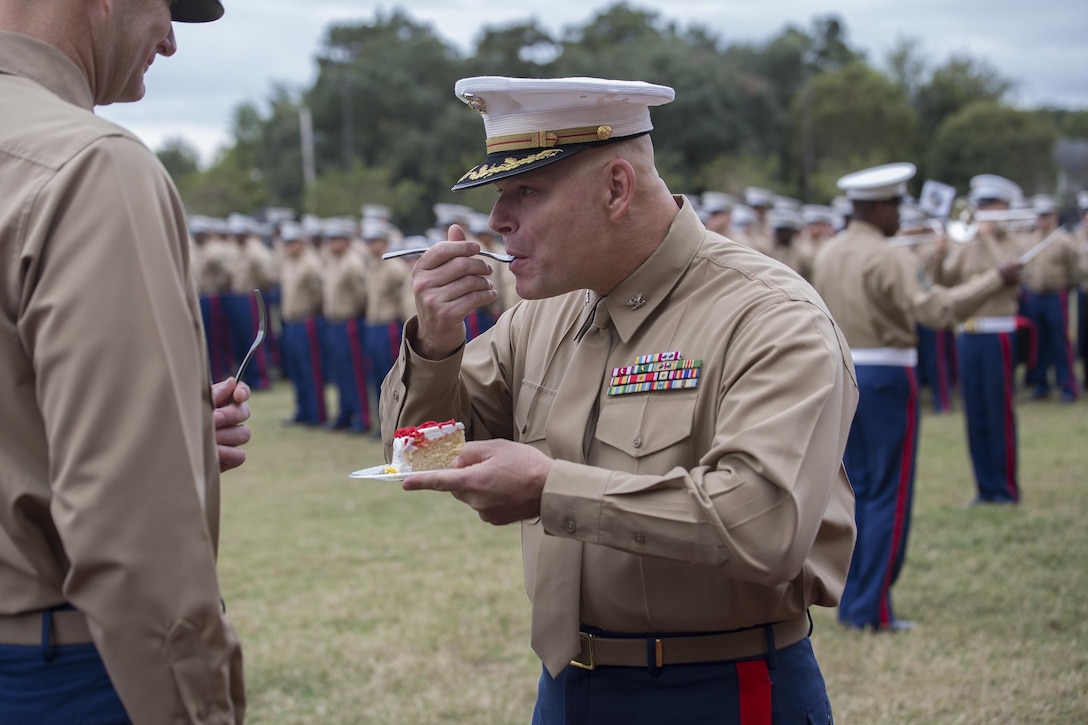 Colonel Reidar Larsen, command inspector general of G-7, Marine Forces Reserve, and the oldest Marine present, takes a bite of cake during the 241st Marine Corps birthday celebration here, Nov. 9, 2016. Each year, the Marines celebrate the Corps’ birthday with a cake-cutting ceremony followed by a run. Since Nov. 10, 1775, the United States Marine Corps has garnered the reputation as the world’s most efficient amphibious fighting force, engaging in combat on battlefronts across the globe since its inception. (U.S. Marine Corps photo by Sgt. Sara Graham/released) 