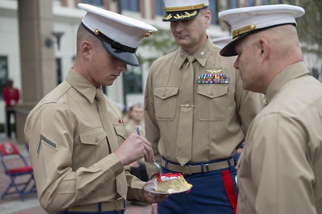 Private First Class Thomas Trevino, server administrator, Headquarters Battalion, Marine Forces Reserve, and the youngest Marine present, takes a bite of cake during the 241st Marine Corps birthday celebration here, Nov. 9, 2016. Each year, the Marines celebrate the Corps’ birthday with a cake-cutting ceremony followed by a run. Since Nov. 10, 1775, the United States Marine Corps has earned the reputation as the world's most effective expeditionary fighting force – engaging in combat on battlefields across the globe. (U.S. Marine Corps photo by Sgt. Sara Graham)