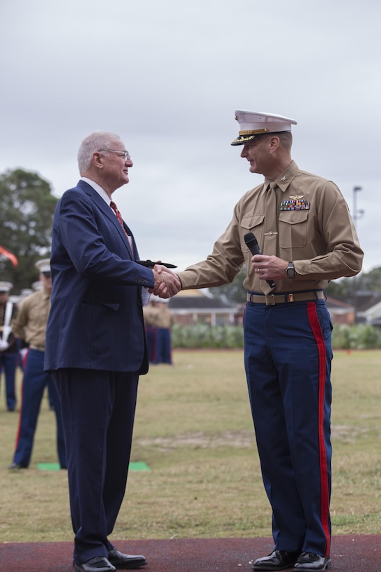 Colonel Derrick Heyl, Commanding Officer of Headquarters Battalion, Marine Forces Reserve shakes the hand of Mike Flynn, a Marine Corps veteran and guest of honor for the 241st Marine Corps birthday here, Nov. 9, 2016. Each year, the Marines celebrate the Corps’ birthday with a cake-cutting ceremony followed by a run. Since Nov. 10, 1775, the United States Marine Corps has earned the reputation as the world's most effective expeditionary fighting force – engaging in combat on battlefields across the globe. (U.S. Marine Corps photo by Sgt. Sara Graham)