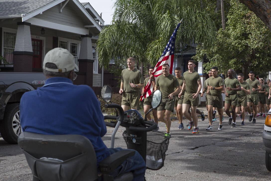 Colonel Derrick Heyl, commanding officer of Headquarters Battalion, Marine Forces Reserve, and Sgt. Maj. Michael J. Rowan, Sergeant Major of Headquarters Battalion, lead Marines from Marine Forces Reserve through the streets here and greet members of the community during a 3-mile motivational formation run, Nov. 9, 2016. Each year, the Marines celebrate the Corps’ birthday with a cake-cutting ceremony followed by a run. Since Nov. 10, 1775, the United States Marine Corps has earned the reputation as the world's most effective expeditionary fighting force – engaging in combat on battlefields across the globe. (U.S. Marine Corps photo by Sgt. Sara Graham)