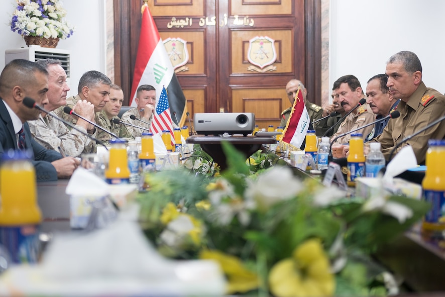 Marine Corps Gen. Joe Dunford, second from left, chairman of the Joint Chiefs of Staff, and Army Lt. Gen. Stephen J. Townsend, commander of Combined Joint Task Force Operation Inherent Resolve, meet with Iraqi chief of defense Lt. Gen. Othman al-Ghanimi and members of his staff.