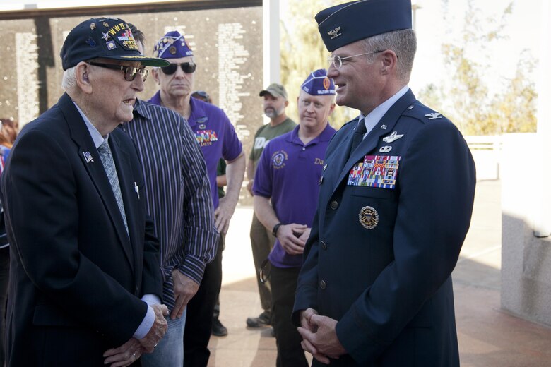 U.S. Air Force retired Senior Master Sergeant Chester Stafford, World War II, Korean and Vietnam veteran speaks with Col. Paul Murray, 99th Air Base Wing commander, Nellis Air Force Base, Nev. the City of Henderson Veterans Memorial Wall during a Veterans Day celebration, Nov. 5.  In 1954, President Dwight D. Eisenhower changed Armistice Day to Veterans Day, in order for Americans to pay homage to veterans of all foreign wars.  (U.S. Air Force photo by Lawrence Crespo)