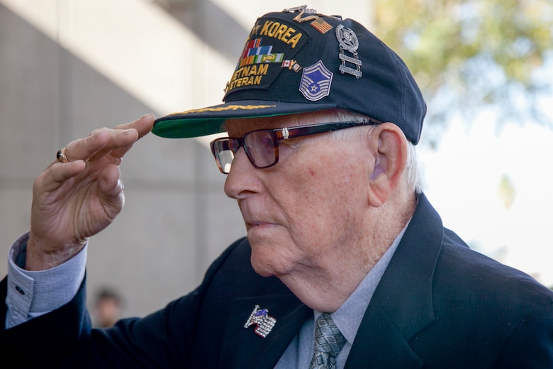 U.S. Air Force retired Senior Master Sergeant Chester Stafford, World War II, Korean and Vietnam veteran renders a salute as the Henderson Symphony Orchestra plays the Air Force song during the City of Henderson, Nev. Veterans Day celebration, Nov. 5.  Veterans Day pays homage to the veterans of all foreign wars who have contributed to the preservation of the nation. (U.S. Air Force photo by Lawrence Crespo)