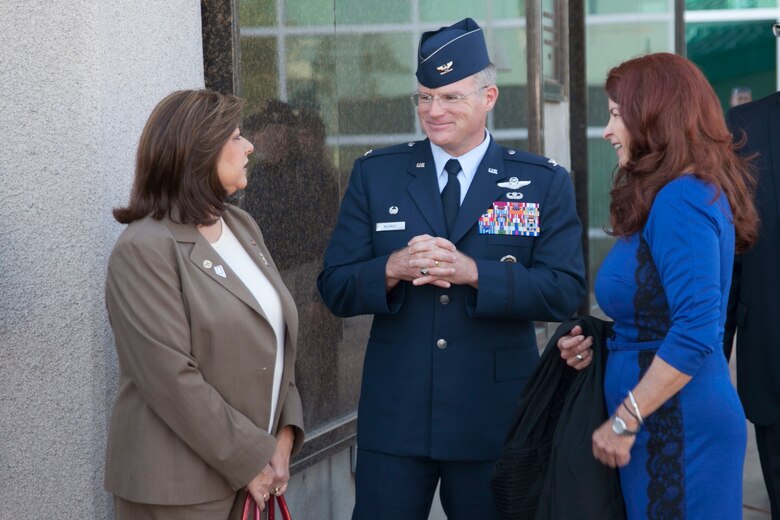 Debra March (left), and Gerri Schroder, City of Henderson, Nev. council members speak with Col. Paul Murray, 99th Air Base Wing commander, Nellis Air Force Base during the city’s Veterans Day celebration, Nov. 5.  Veterans Day recognizes all who served in the armed forces. (U.S. Air Force photo by Lawrence Crespo)