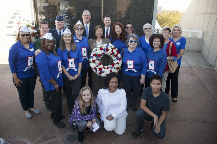 Col. Paul Murray, 99th Air Base Wing commander, Nellis Air Force Base and Mayor Andy Hafen Henderson, Nev. (back row) pose with Blue Star Mothers of Henderson, during the city’s official Veterans Day celebration, Nov. 5.   Blue Star Mothers of America are mothers, stepmothers, grandmothers, foster mothers and female legal guardians who have children serving in the military, guard or reserves, or children who are veterans. (U.S. Air Force photo by Lawrence Crespo)