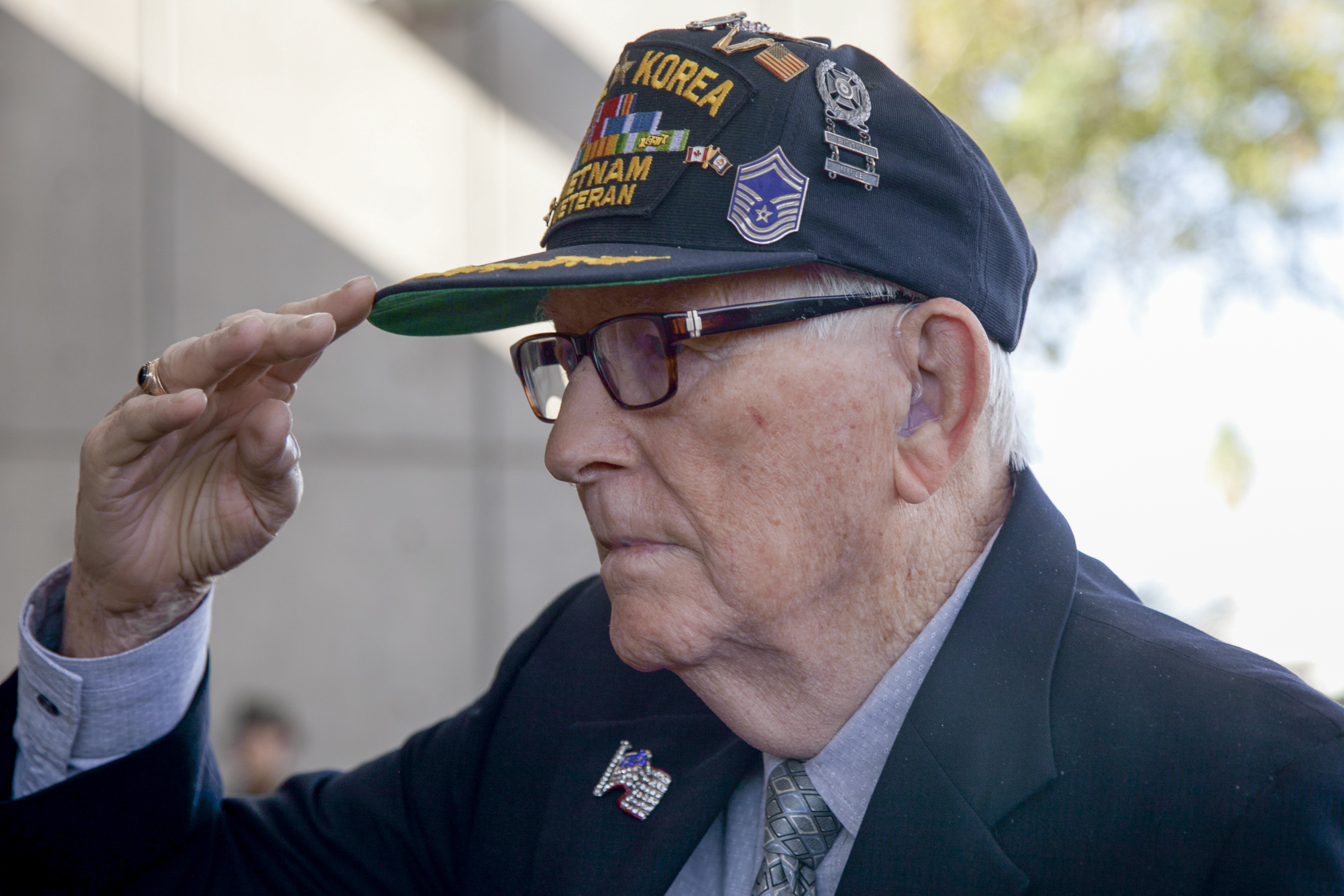 Retired Air Force Senior Master Sgt. Chester Stafford, a veteran of World War II, Korean and Vietnam Wars, renders a salute