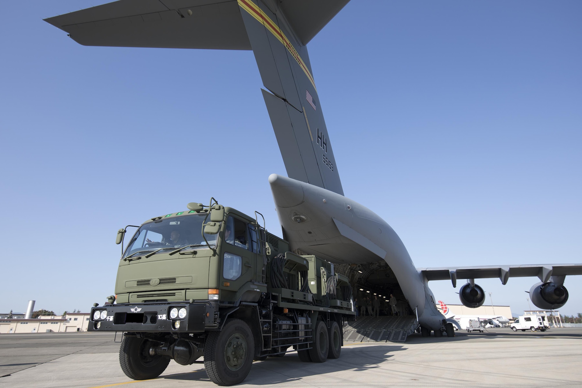 A Japan Air Self-Defense Force Electric Power Plant vehicle with the 10th Fire Unit, Chitose Air Base is driven in reverse onto a U.S Air Force C-17 Globemaster III at Yokota Air Base, Japan, Nov. 6, 2016, during the exercise Keen Sword 2017. This is the first time to an EPP vehicle loading onto USAF aircraft. Units from the U.S. military conduct training with Japan Self-Defense Forces counterparts at military installations throughout Japan, the Mariana Islands and in the surrounding waters. All participating units train in a comprehensive scenario that is designed to practice the critical capabilities and interoperability required to support the defense of Japan, and to respond to a potential crisis or contingency in the Indo-Asia-Pacific region. (U.S. Air Force photo by Yasuo Osakabe/Released)